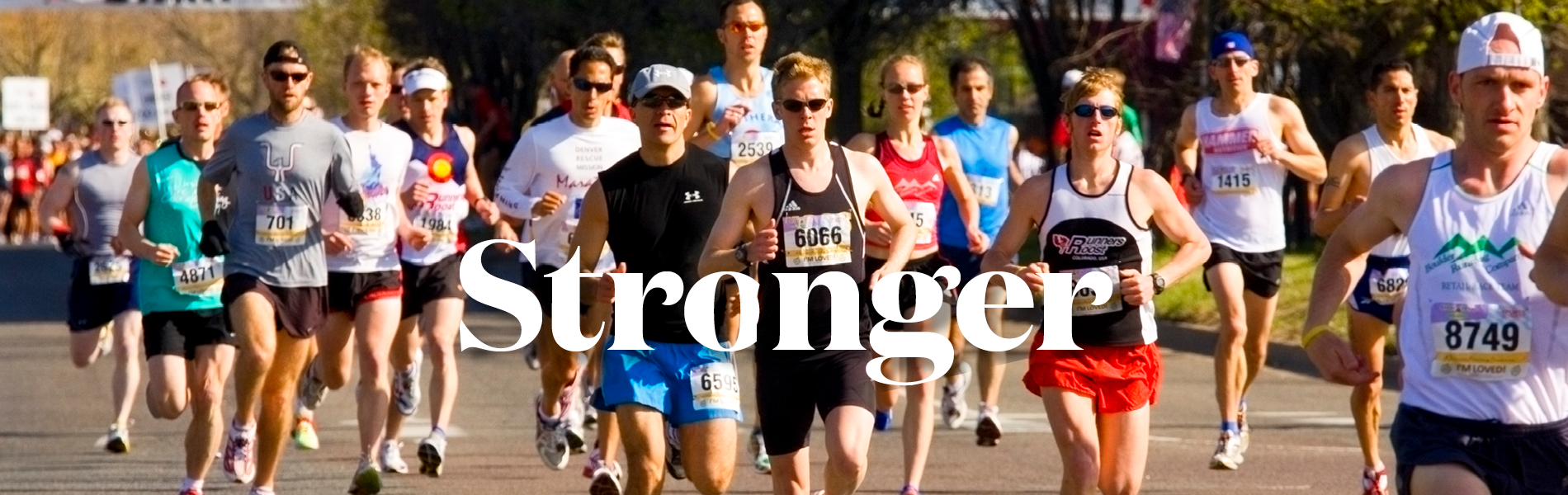 Group of people running a race on a street